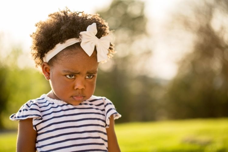 young girl not happy face