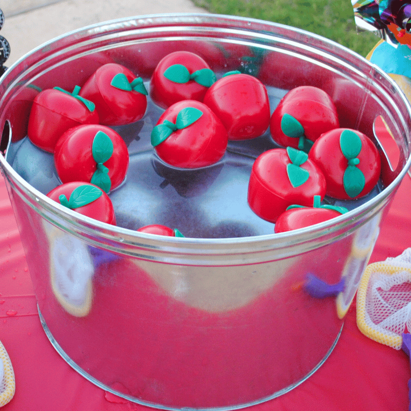 plastic apples floating in water